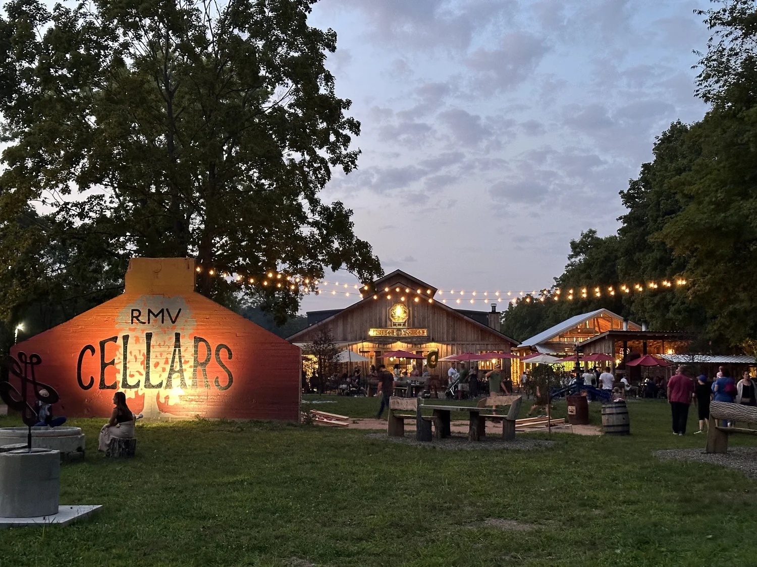 RMV Cellars beer garden under string lights at dusk
